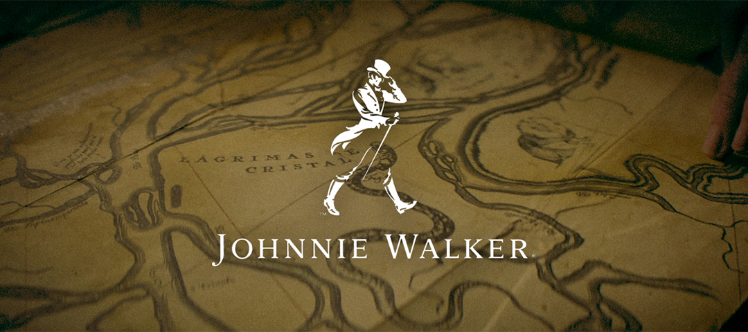 Johnnie Walker commercial director treatment cover featuring the walking man icon over a vintage map